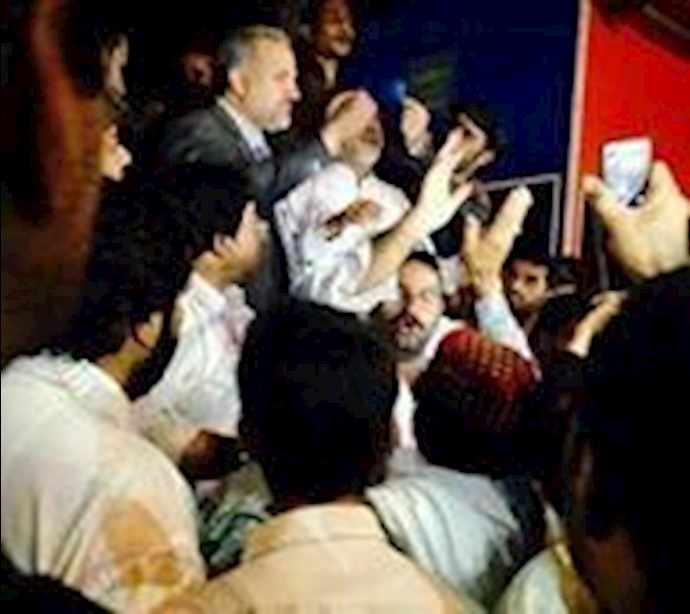 People Clash with riot police to release youth