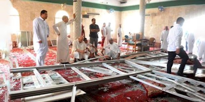  'Family members of victims and well-wishers are seen after a suicide bomb attack at the Imam Ali mosque in the village of al-Qadeeh, May 22, 2015'