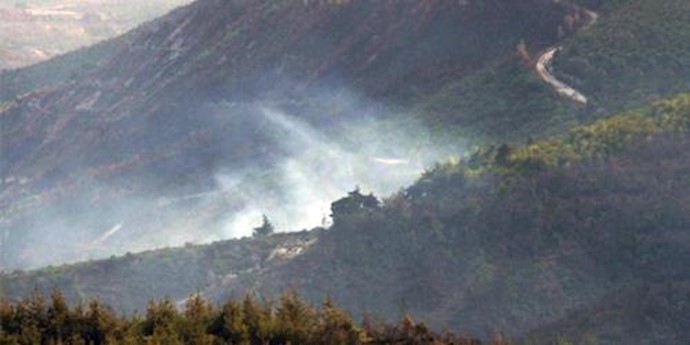  'Smoke rises from the Syrian side of the border after a Turkish jet downed a Syrian military helicopter near Hatay province, Turkey'