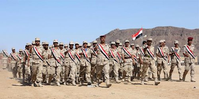  'Yemeni government Troops march during a parade commemorating the 52nd anniversary of the start of South Yemens uprising against the British rule'