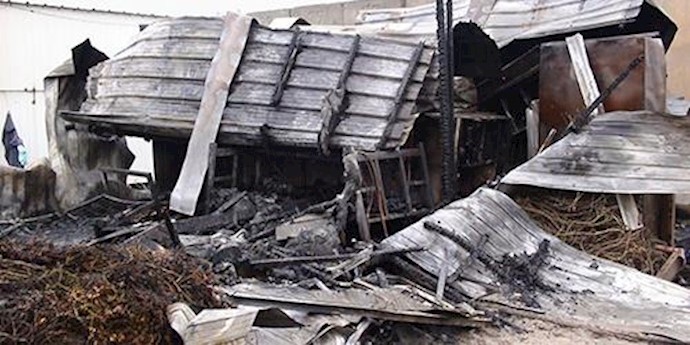  'Chard and mangled remains of living trailers in Camp Liberty, Oct. 29, 2015'