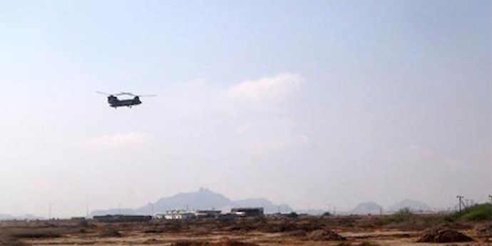  'A military helicopter evacuates wounded people after a rocket attack on October 6, 2015 on the outskirts of the city of Aden in Yemen'