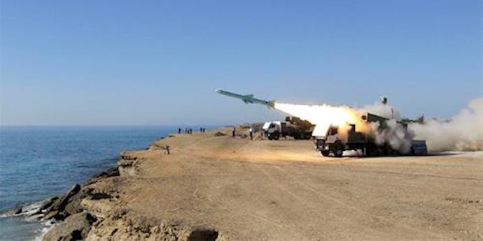  'A Ghader missile is launched from the area near the Iranian port of Jask on the shore of the Gulf of Oman during an Iranian navy drill'