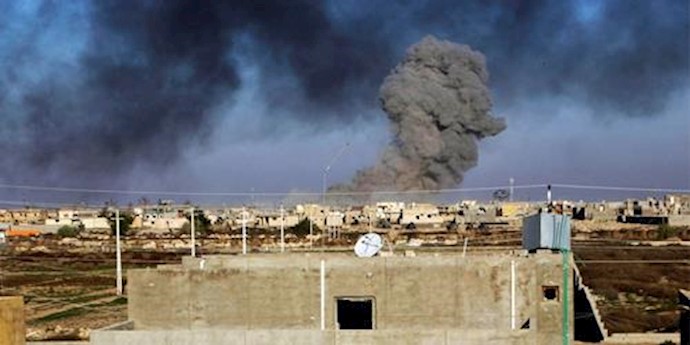  'Smoke rises from ISIS positions following a U.S.-led coalition airstrike in downtown Ramadi'