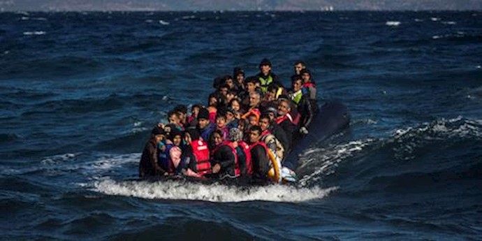  'Afghan migrants on an overcrowded inflatable boat approach the Greek island of Lesbos'
