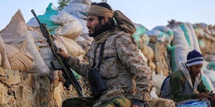  'Yemeni tribesmen from the Popular Resistance Committees hold a position in the countrys third city Taez'