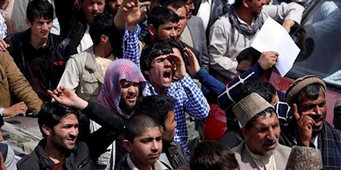 Afghan men march to demand reinstatement of woman governor