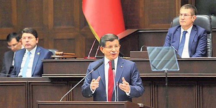  'Turkish Prime Minister Ahmet Davutoğlu speaks to fellow party members at a parliamentary meeting in Ankara December 08, 2015'