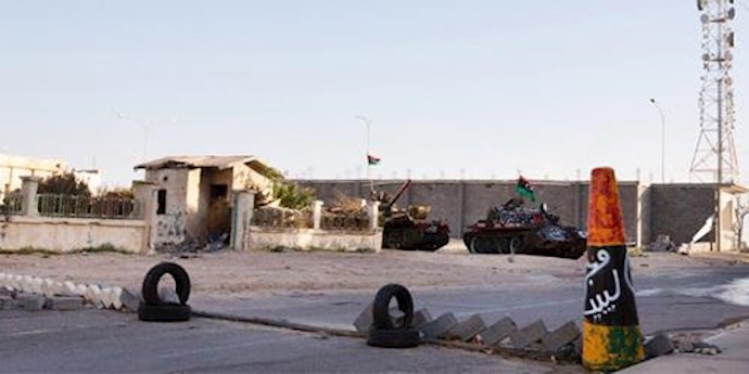  'Military tanks are seen outside the broadcast station in Sirte, Libya'
