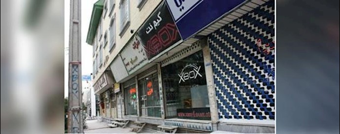Tehran: A Basij paramilitary harassing people kicked out of a café