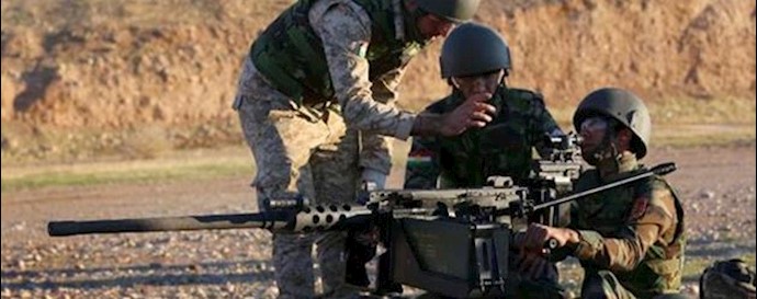  'Kurdish Peshmerga fighters train with British military advisers at a shooting range on the outskirts of Arbil'