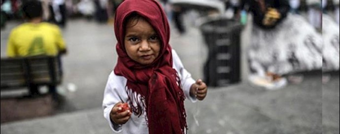  'A Syrian refugee child upon his arrival onboard the Eleftherios Venizelos'