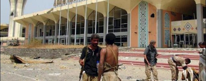  'Armed men loyal to Yemeni President Abderabbo Mansour Hadi stand at the entrance to Aden international airport '