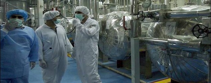  'International Atomic Energy Agency technicians inspect the site of a uranium conversion plant in Isfahan, central Iran, in 2007-'