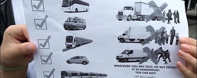  'Placard warns refugees to not travel with trucks'