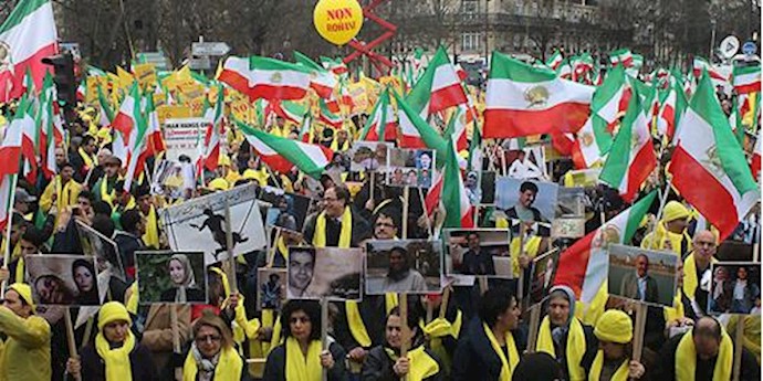  'Rouhani met a stiff protest by Iranians as he was signing business deals with French businesses'