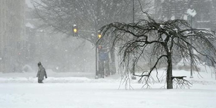  'A man walks on snow covered Thomas Circle in Washington DC on January 23'