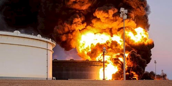  'Fire rises from an oil tank in the port of Es Sider, in Ras Lanuf, Libya '