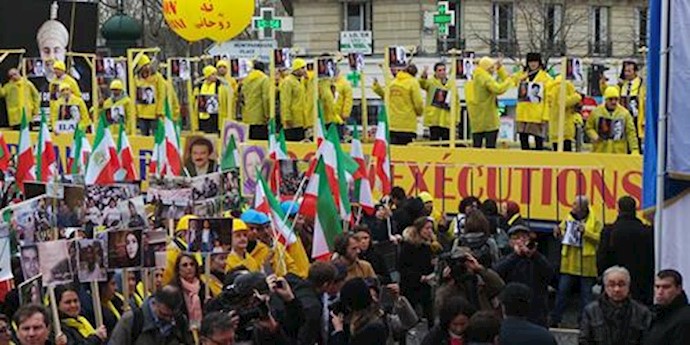 Concurrent with Rouhani’s visit to France, thousands of Iranians demonstrate against Rouhani’s presence in Paris