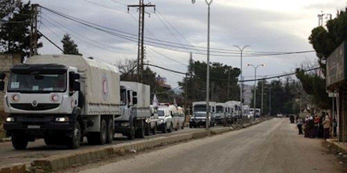  'A convoy of vehicles loaded with food and other supplies organized by The International Red Cross Committee'