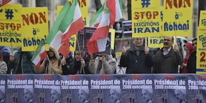 The French activist protest during Rouhani visit to Paris