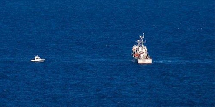  'Six more bodies found after two migrant boats sank off Greece early Friday, raising the toll to 21 with dozens still missing'