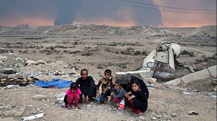  'Internally displaced persons in Qayyarah, south of Mosul, Iraq, Sunday, Oct. 23, 2016'