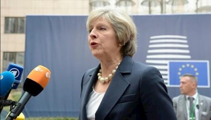  'Britains Prime Minister Theresa May speaks to reporters ahead of a European Union summit in Brussels, on October 20, 2016'