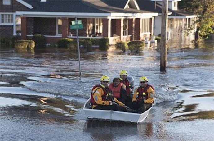 Hurricane’s cost, chaos lingers in water-logged N. Carolina