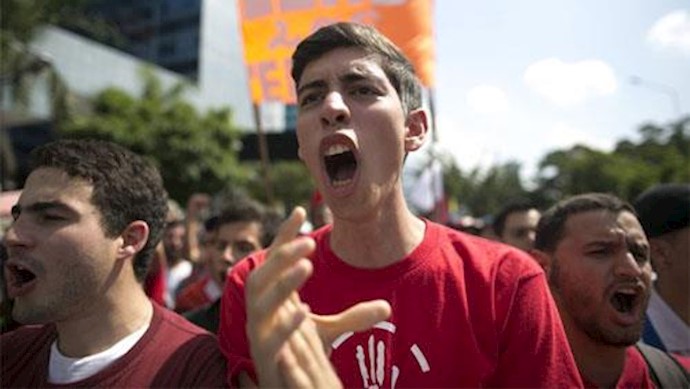 Protesters march for end of ‘dictatorship’ amid standoff