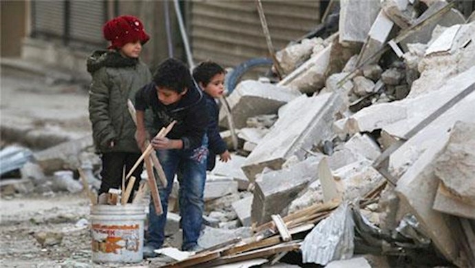  'Children collect firewood amid debris in rebel-held al-Shaar neighbourhood in Aleppo'