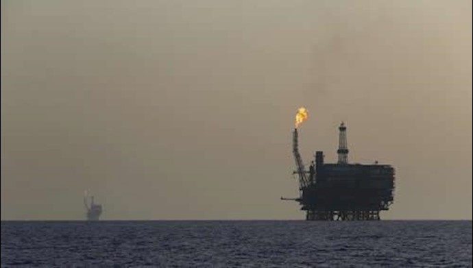 Oil down on strong dollar, OPEC uncertainty