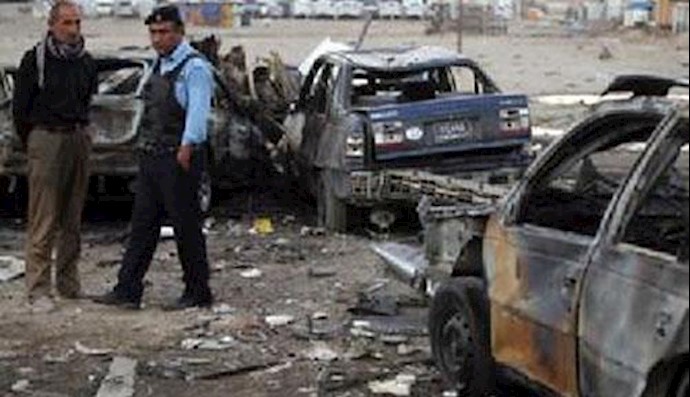  'Iraqi Police and civilian inspect the site of a car bomb attack(File photo)'