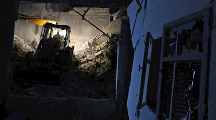  'Civil defense members work at a site hit at night by an airstrike in Saraqeb, in rebel-held Idlib province, Syria December 11, 2016'