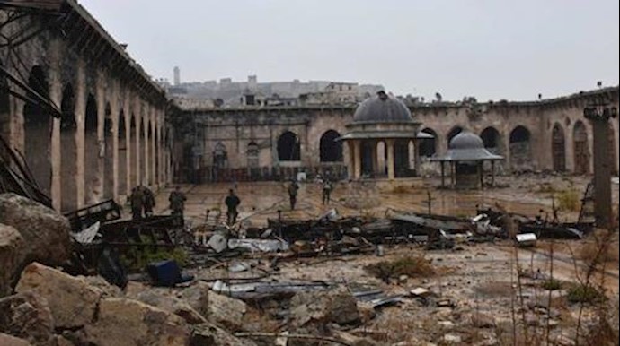  'Syrian troops and pro-government gunmen inside the damaged Grand Umayyad mosque in the old city of Aleppo'