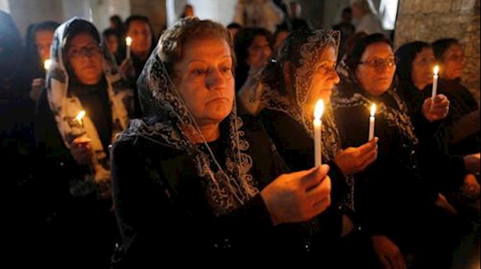  'Iraqi Christians attend a mass on Christmas eve at the Mar Shemoni church in the town of Bartella east of Mosul, December 24, 2016'