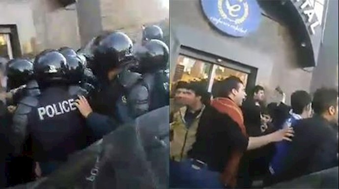 Iranian people clash with repressive riot police in Tehran