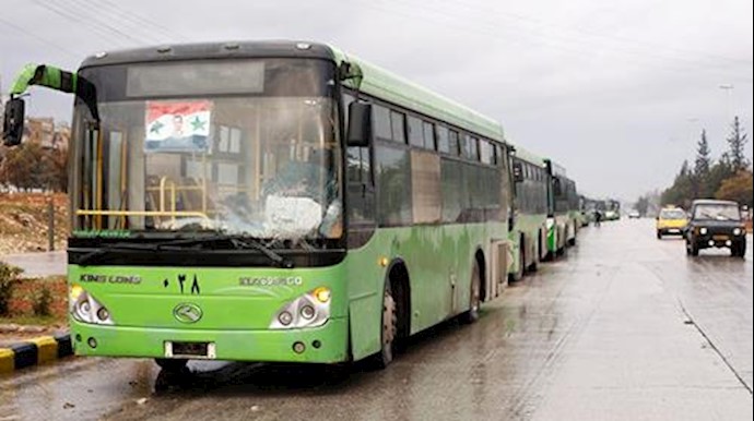  'Buses waiting to evacuate people from a rebel pocket in Aleppo, Syria, on Wednesday'