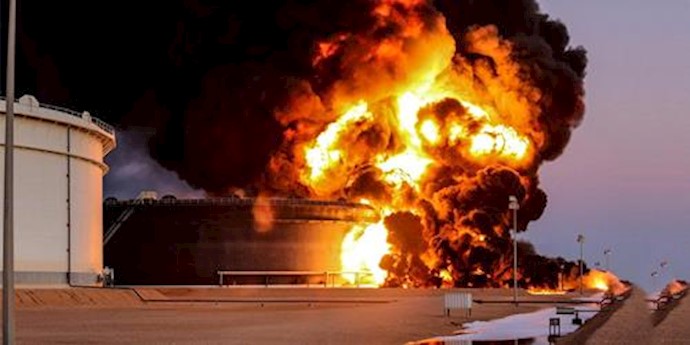  'Fire rises from an oil tank in the port of Es Sider, in Ras Lanuf, Libya'