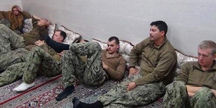  'American sailors sitting in an unknown place in Iran'