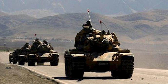  'Turkish army tanks are seen near the Turkish-Iraqi border town of Silopi in the Sirnak province, southeastern Turkey'