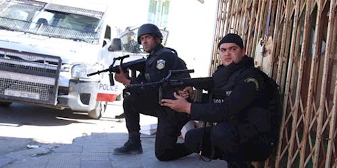  'Tunisian police stand guard after Monday attack by militants on an army and police barracks in the town of Ben Guerdan, Tunisia  '