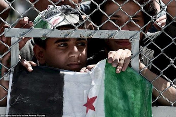 Pope brings 12 Syrian Muslim refugees to Italy after a trip to the Greek island of Lesbos