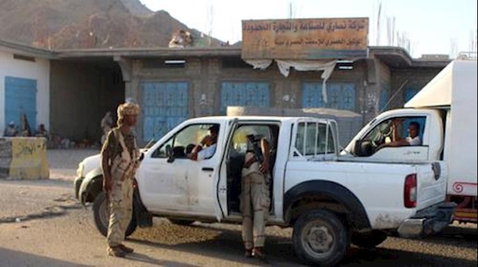 'Yemeni troops search a vehicle at a checkpoint following suicide attacks in the southeastern Yemeni port of Mukalla'