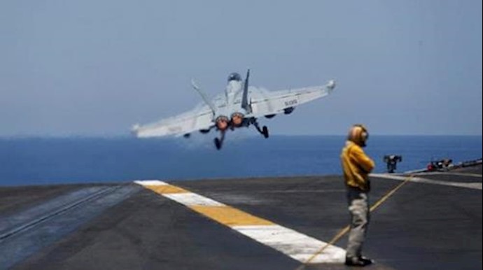  'F-A-18 fighter jet takes off from the USS Harry S. Truman aircraft carrier in the eastern Mediterranean Sea'