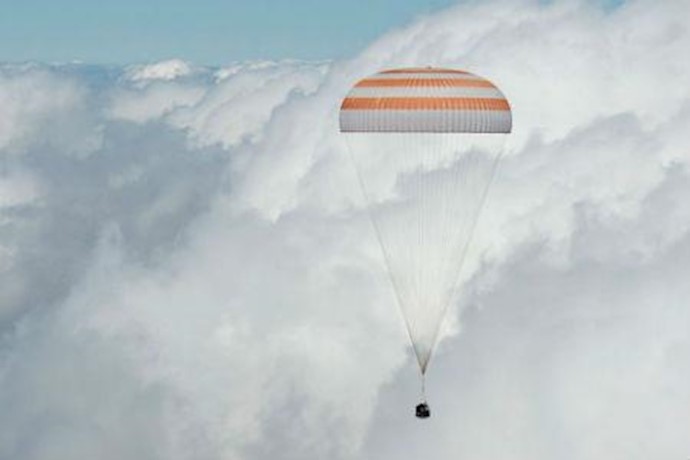 Three International Space Station astronauts touch down after 6 months in space