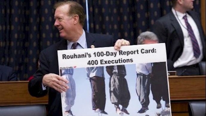  'Texas Rep. Randy Weber, holding a sign citing executions in Iran before a House Foreign Affairs Committee hearing in 2013.'