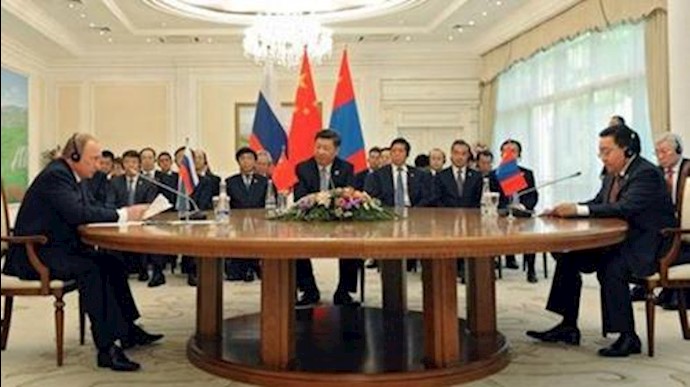  'Vladimir Putin, Chinese President and Mongolian President in Shanghai Cooperation Organization summit in Tashkent, Uzbekistan, June 23, 2016.'