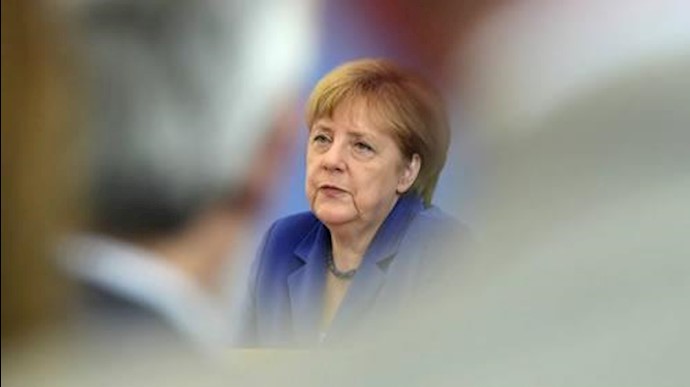 Merkel rejects reversing refugee policy after attacks