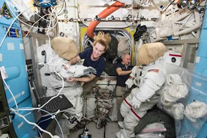 Int. Space Station astronauts begin spacewalk to install new docking port